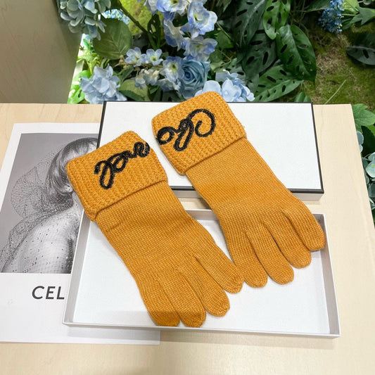 CHANEL GLOVES IN MUSTARD YELLOW WOOL WITH BLACK LOGO 465776